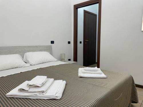 Postel nebo postele na pokoji v ubytování Ospitaci - Via Pertichetti