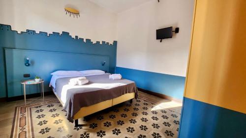 Un ou plusieurs lits dans un hébergement de l'établissement Hotel Bello by Ostello Bello