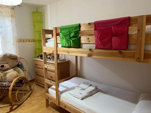 a bedroom with a bunk bed with a teddy bear at Casa Valsugana Lagorai in Roncegno