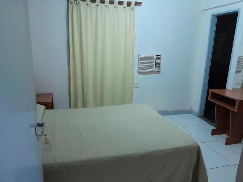 a hospital room with a bed and a window at Hotel PANAME, CERCA DE LA RURAL , EMBAJADA EEUU , HIPÓDROMO DE PALERMO Y CAMPO DE POLO in Buenos Aires