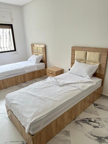 Postel nebo postele na pokoji v ubytování Room in shared apartment AGDAL RABAT