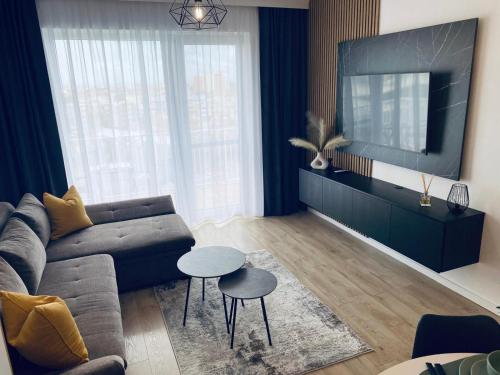 TV a/nebo společenská místnost v ubytování Bella Residence