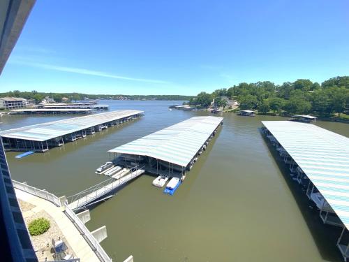 an aerial view of a marina on a river at B Lakefront! Remodeled, Boat Slip, Patio Views, Pool, Boat Ramp, WIFI in Osage Beach