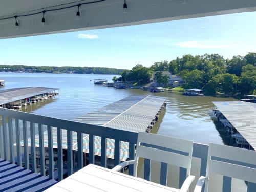 a view of a river from a balcony at B Lakefront! Remodeled, Boat Slip, Patio Views, Pool, Boat Ramp, WIFI in Osage Beach