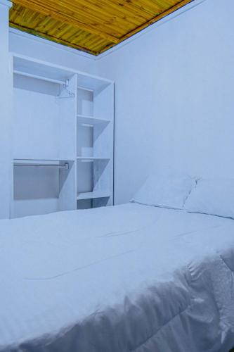 Ένα ή περισσότερα κρεβάτια σε δωμάτιο στο Winnie's Cozy Home