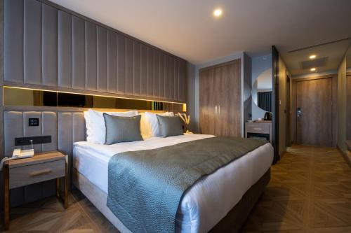 Ένα ή περισσότερα κρεβάτια σε δωμάτιο στο Buke Hotel Bomonti