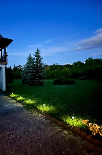 a lawn with lights on the side of a road at Green Forest Visoko in Visoko
