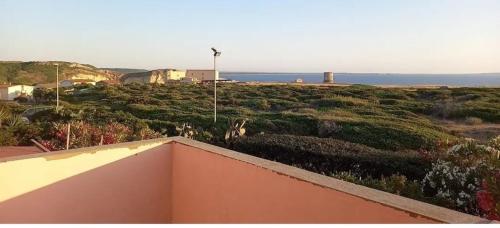 a view of the ocean from the balcony of a house at Villetta Macchia Mediterranea in Cuglieri