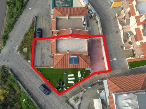 an overhead view of a building with red roof at Cas'Aurora in Tresnuraghes