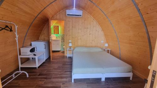 A bed or beds in a room at Camping Dal Pino