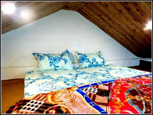 Postel nebo postele na pokoji v ubytování THE HIDEAWAY Homestay Chail