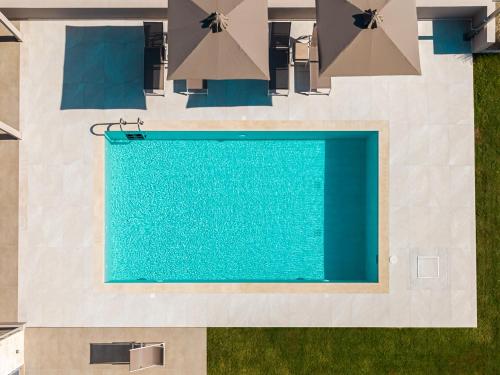 an overhead view of a swimming pool in a house at Terra Petra Luxury Villas by Travel Pro Services- Vourvourou Halkidiki in Vourvourou