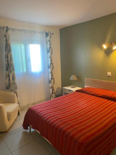 En eller flere senge i et værelse på Résidence "Hotel Beausoleil"