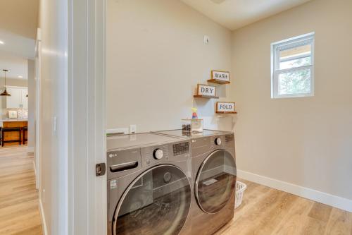 a laundry room with a washer and dryer at Spacious Donnelly Family Home with Private Hot Tub! in Donnelly