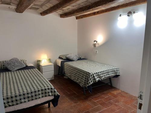 Säng eller sängar i ett rum på Cataluña Room