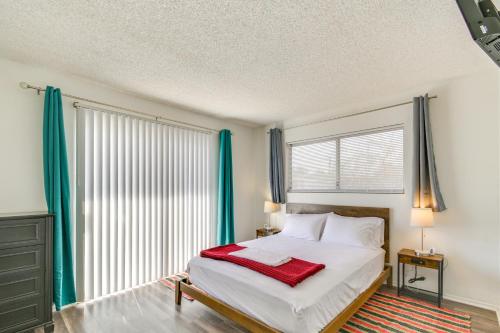 a bedroom with a bed and a large window at Bullhead City Home - Near Colorado River! in Bullhead City