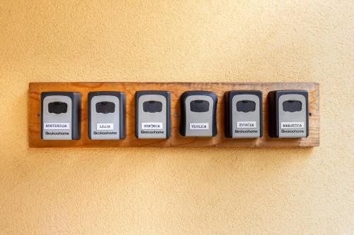 a row of computer keys on a wall at Apartments Orhideja in Tolmin