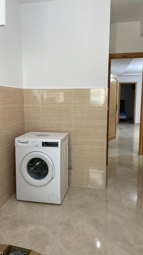 a washing machine sitting in the corner of a room at Tanger Relax Appartement in Tangier