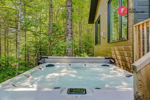 a hot tub in the backyard of a house at La Sunny-Haus de Portneuf / 25 min from Quebec City in Pont-Rouge