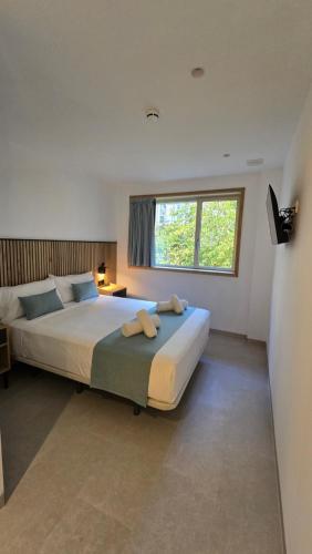 Postel nebo postele na pokoji v ubytování Hostal Rambla 24 by Holihome