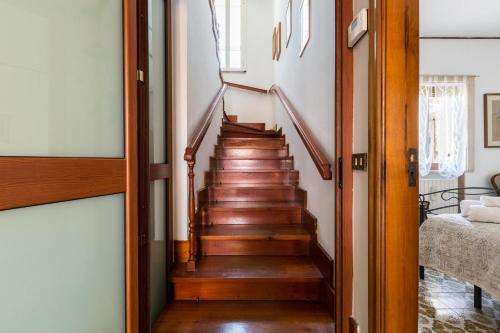 a staircase in a house with wooden floors at Villa Bea by BarbarHouse in Taranto