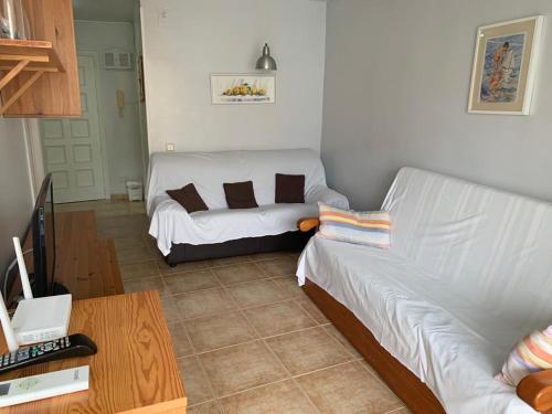 A seating area at SERVICE APART LAZARO - Aguamarina 1 dormitorio