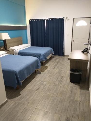 a hospital room with two beds and a desk at Villa Salvatore in Chiconcuac