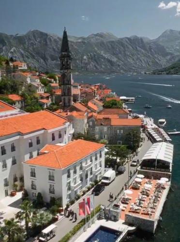 an aerial view of a city with a clock tower at Perast apartman "Mika" in Perast