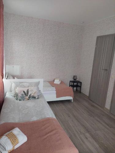 Кровать или кровати в номере Lapių Ola