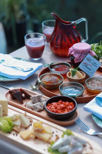 a table topped with plates of food on a table at Hotel Thethi in Theth