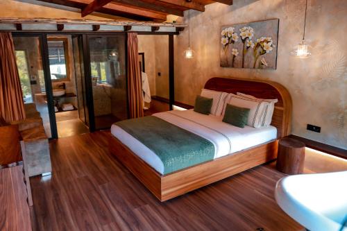 a bedroom with a large bed in a room at Hotel Thethi in Theth