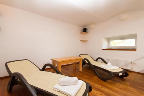 a room with three chairs and a table at Bedřichovská Devítka in Bedřichov