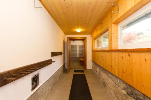 a hallway with wood paneling and a ceiling at Bedřichovská Devítka in Bedřichov