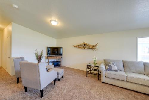 a living room with a couch and chairs and a tv at Smith River Home with Boat Launch and Ocean Views in Smith River