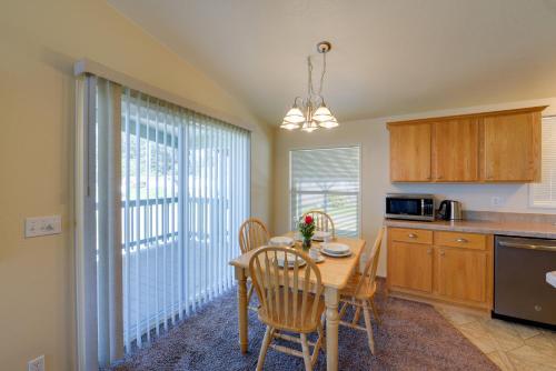 a kitchen with a wooden table and a dining room at Smith River Home with Boat Launch and Ocean Views in Smith River