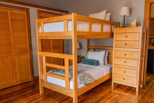 a bedroom with a bunk bed and a dresser at Anthony's Key Resort in Sandy Bay