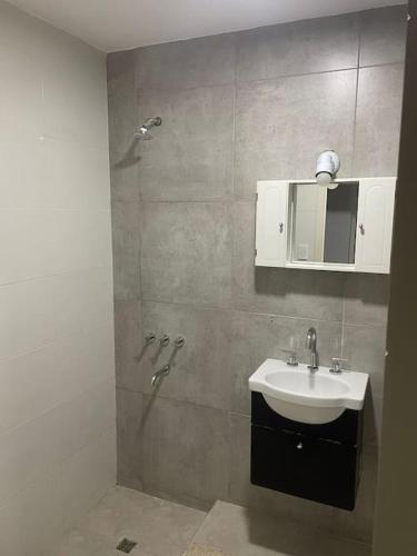 a bathroom with a sink and a shower at Encanto floral 2Pax - By Inside in Guaymallen