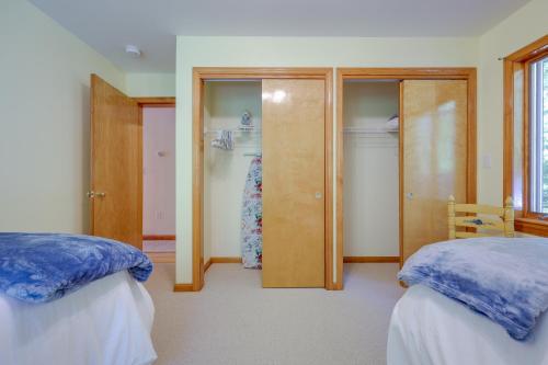 a bedroom with two beds and a closet at Serene Steuben Home with Scenic Ocean Views! in Steuben