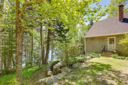 a small house in the woods with a yard at Serene Steuben Home with Scenic Ocean Views! in Steuben
