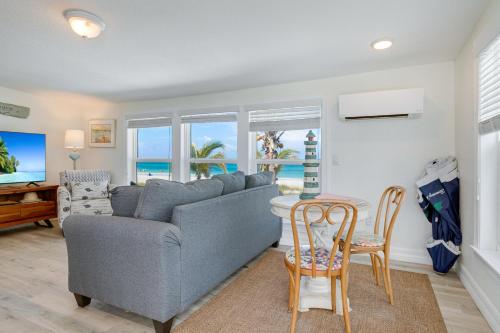 a living room with a couch and a table and chairs at Beach Dreams Resort in Bradenton Beach