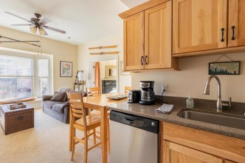 a kitchen with a sink and a counter top at HISTORIC COMFY CONDO- Heart of Ellicottville, Self Checkin in Ellicottville