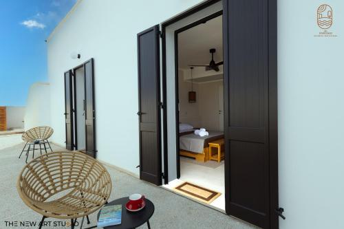 a room with sliding glass doors leading to a bedroom at Al Poggiale - Residenza Mediterranea in Porto Cesareo