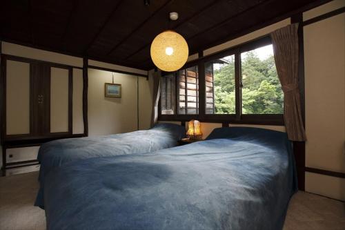 A bed or beds in a room at Hazuki