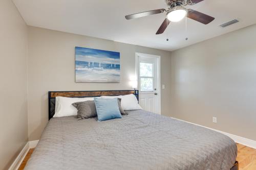 a bedroom with a bed with a ceiling fan at 16 Mi to Manatee Viewing! Spacious Tampa Retreat in Tampa