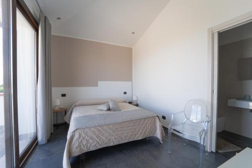 Una cama o camas en una habitación de B&b Villa Cusenza