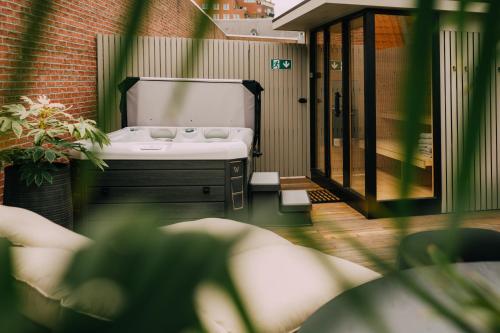a bathroom with a sink and a mirror at TheBridge29 boutique apartment in Breda