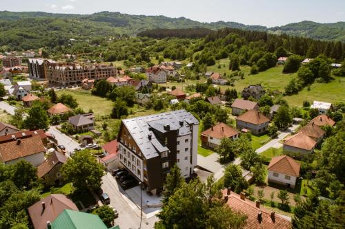 an aerial view of a small town with buildings at MODERN MOUNTAIN II in Kolašin