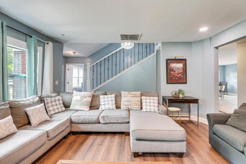 a living room with a couch and a table at Walterboro House with Office Near Wildlife Center in Walterboro