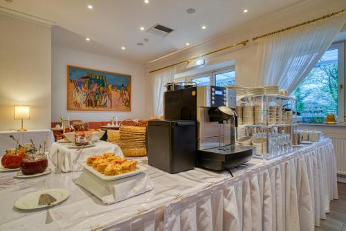 a buffet line with food on top of it at Parkhotel Am Glienberg by NP in Zinnowitz