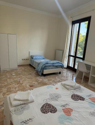 a bedroom with two beds in a room at Il Sogno in Senigallia